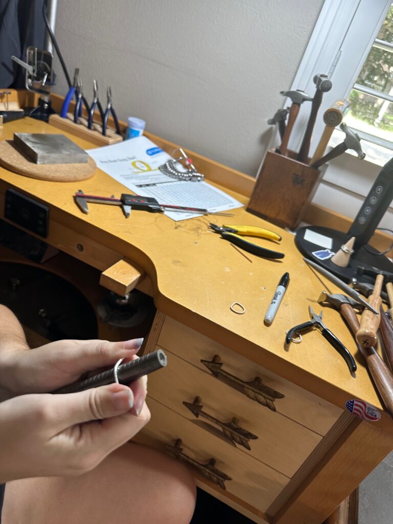 Student making sterling silver stack ring