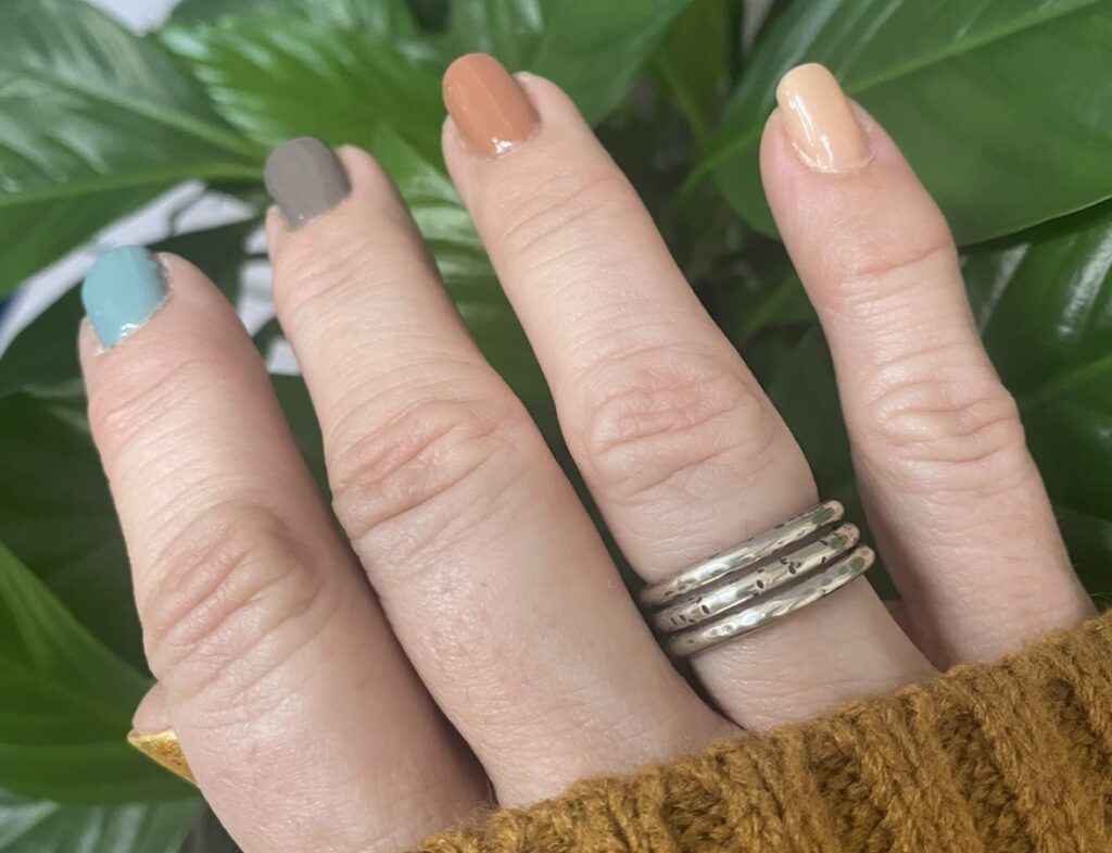 sterling silver stack rings on hand