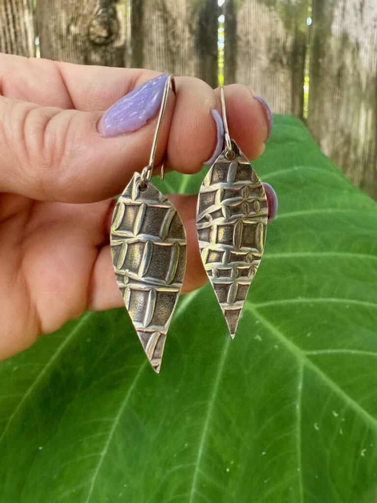 one pair of sterling silver earrings